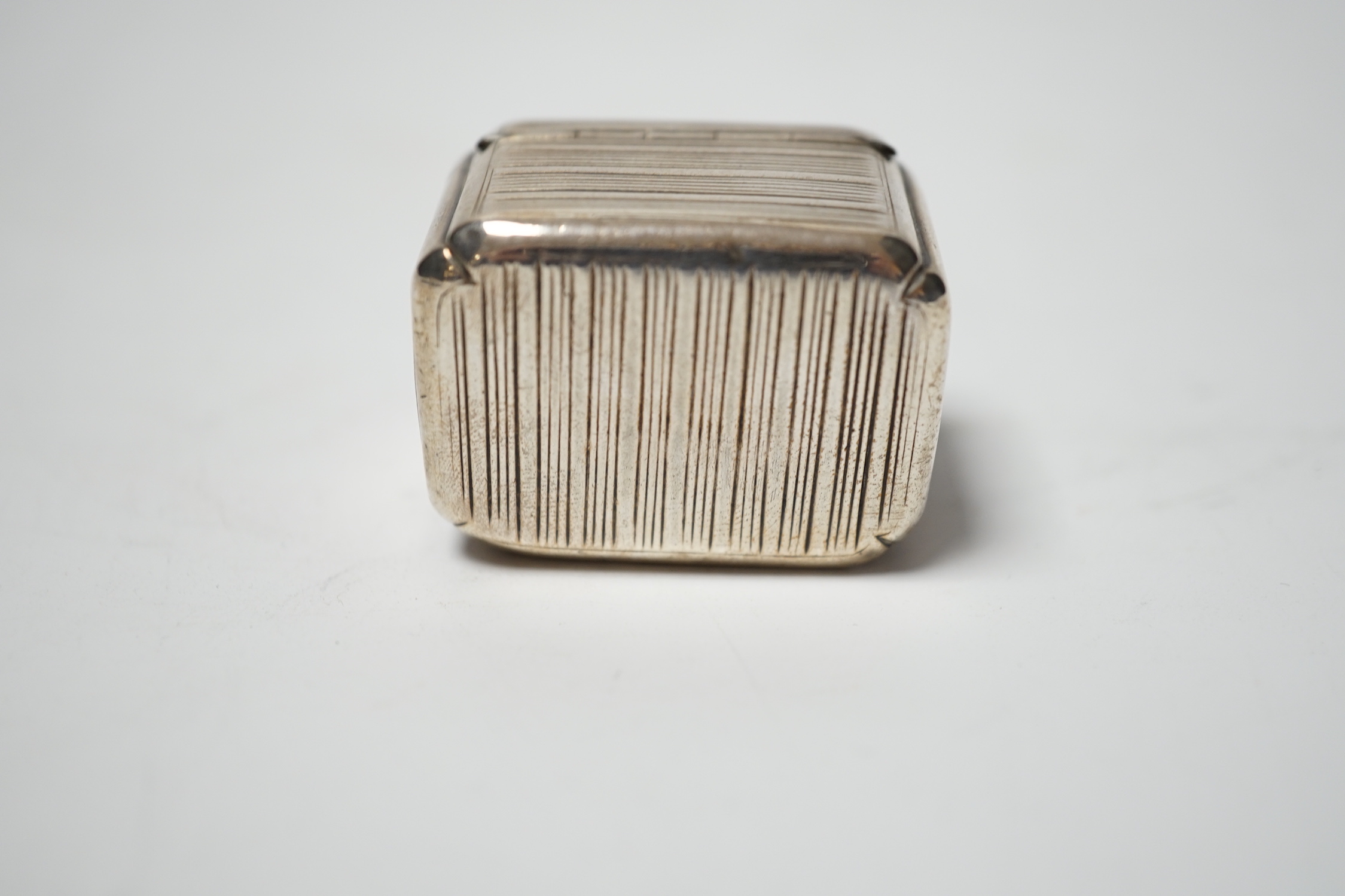 A George III reeded silver nutmeg grater, maker's mark rubbed, London 1812, 37mm.